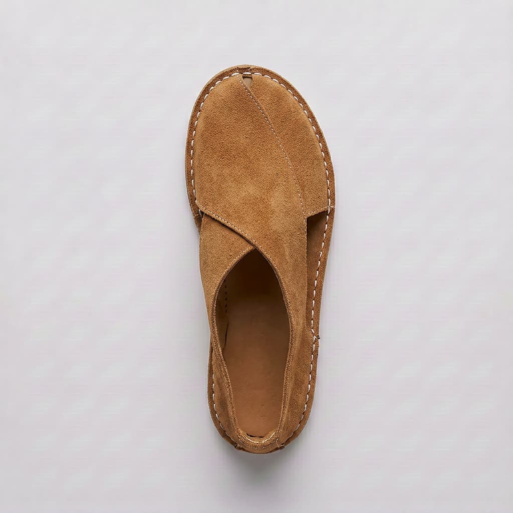 Brown sandal on a light gray background