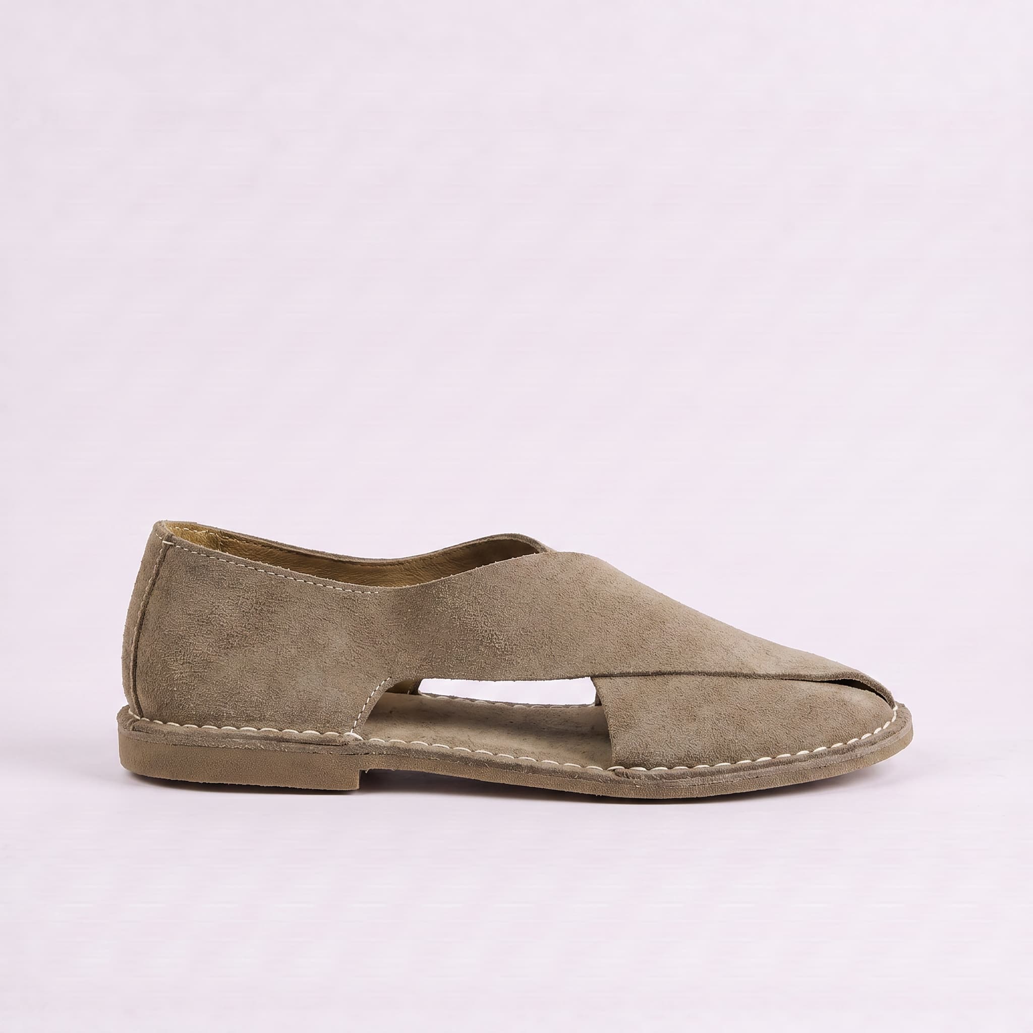 Beige sandal on a light gray background