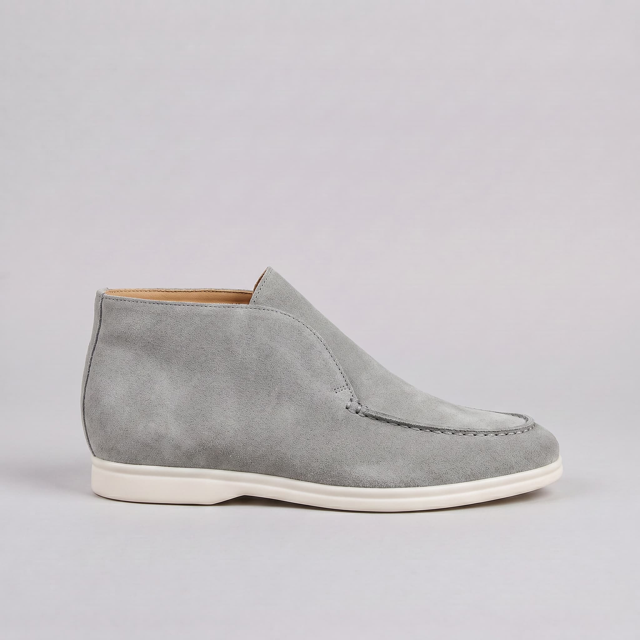 Gray suede loafer shoe on a light gray background