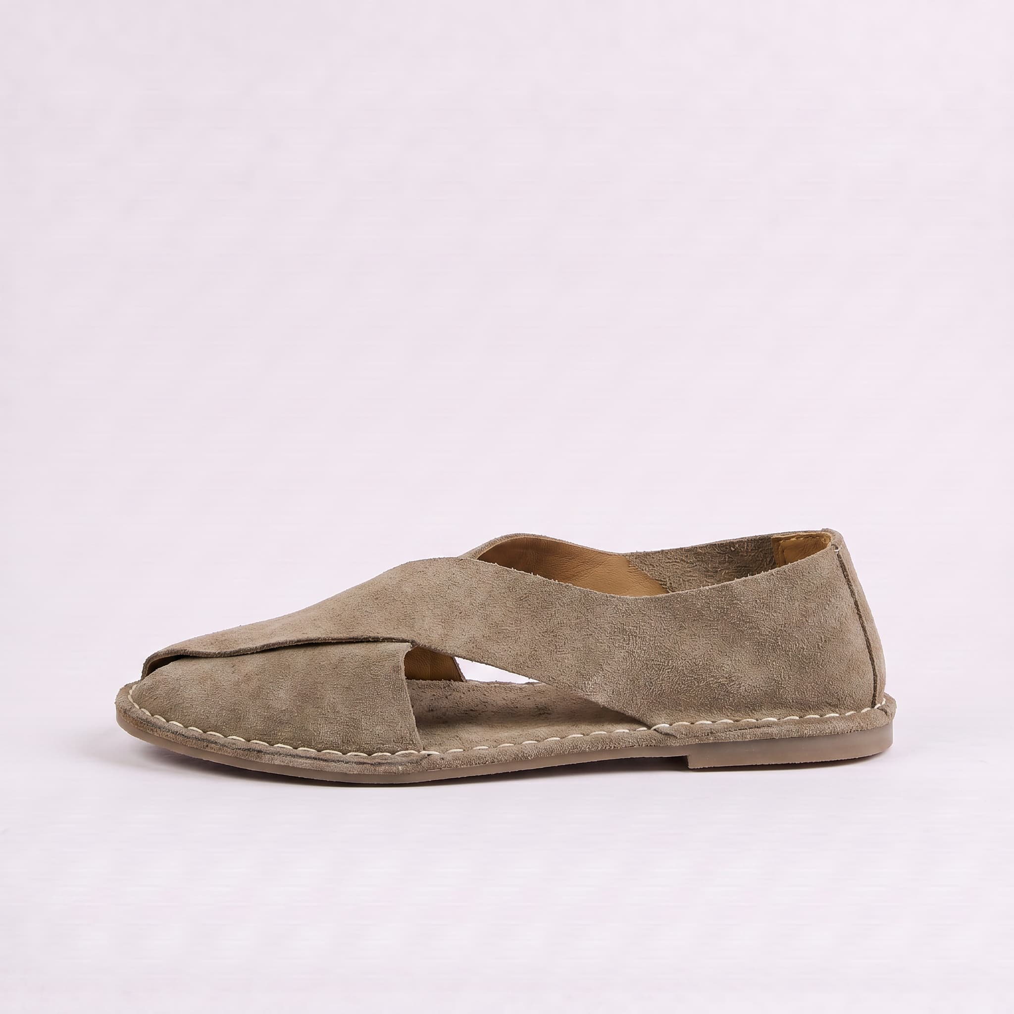 Brown sandal on a light gray background