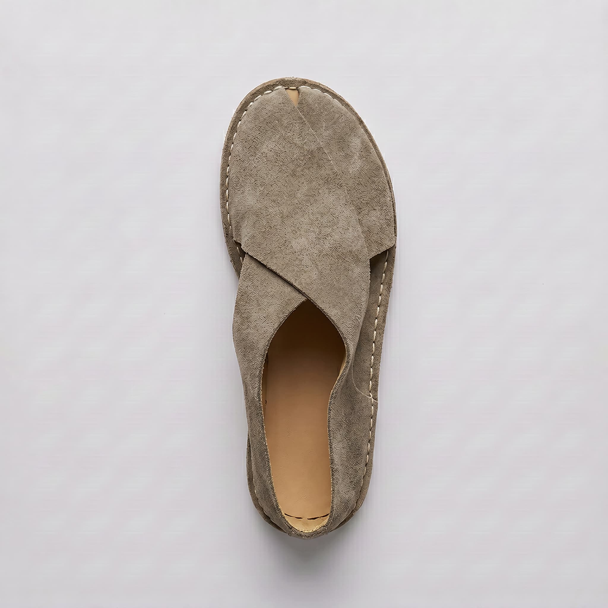 Beige sandal on a light gray background