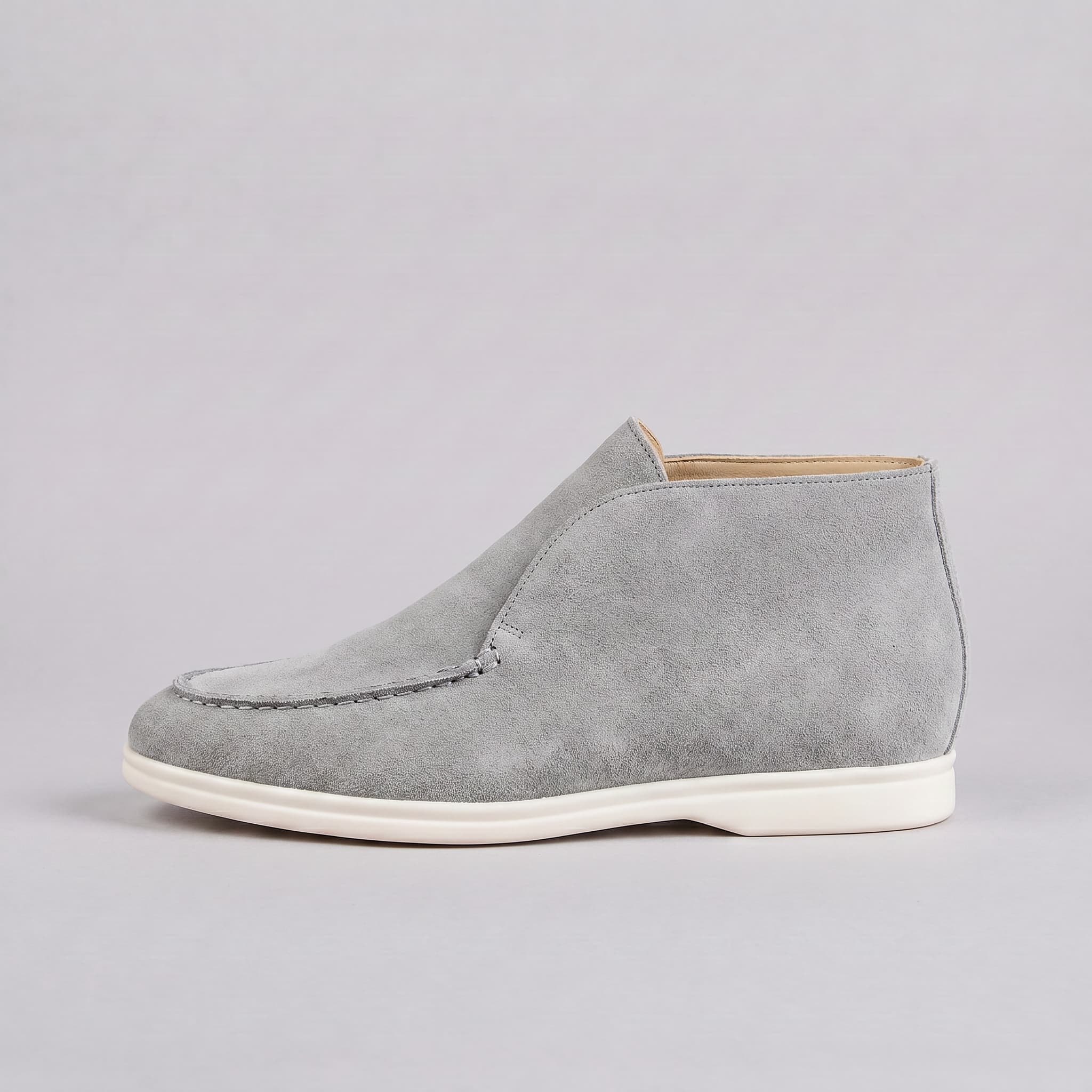 Gray suede shoe on a light gray background