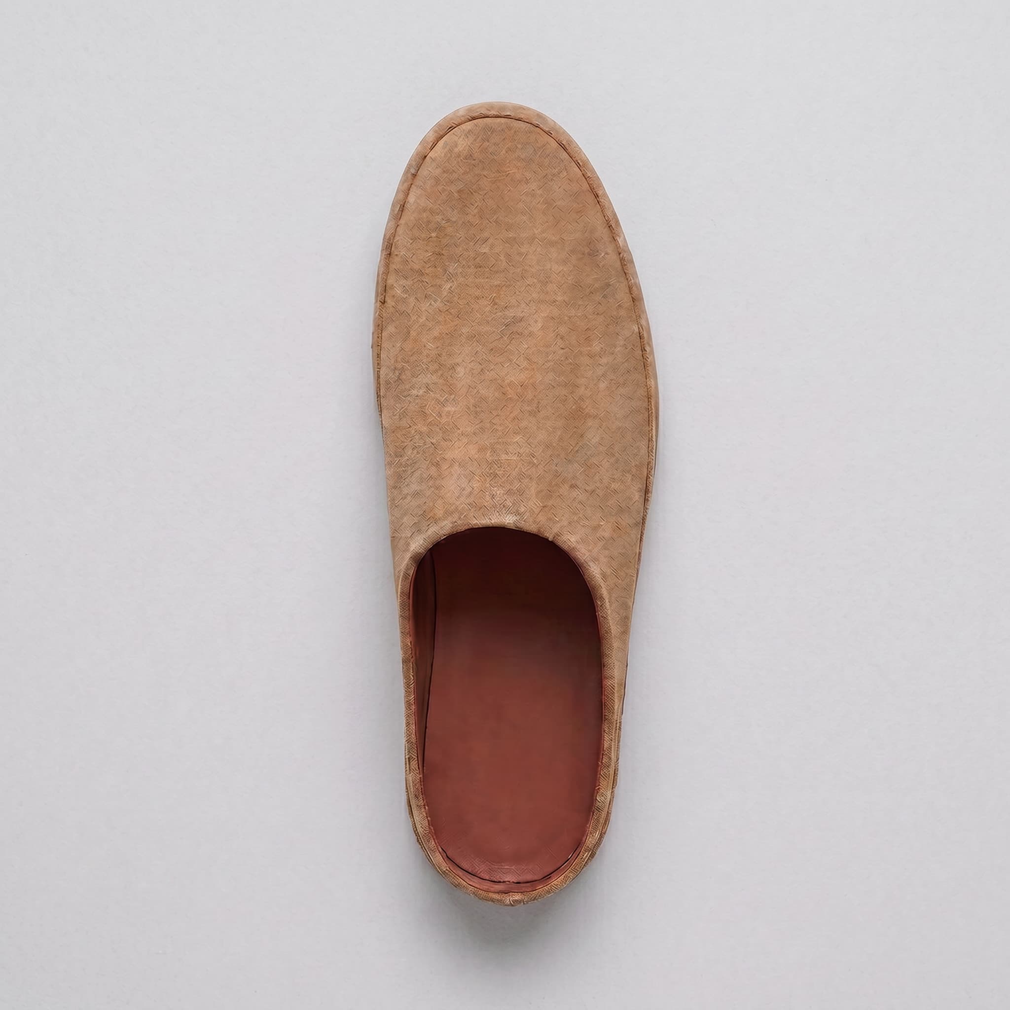 Brown slipper on a light gray background
