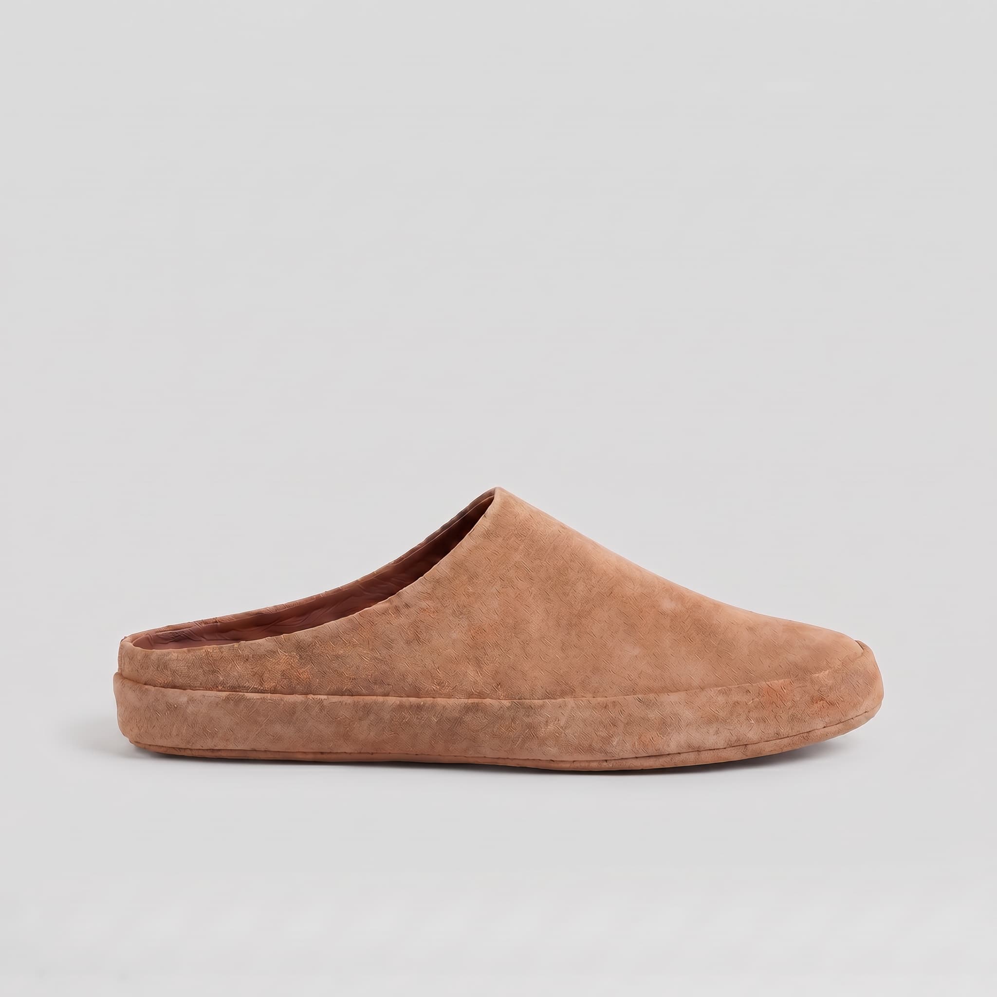 Brown slipper on a light gray background